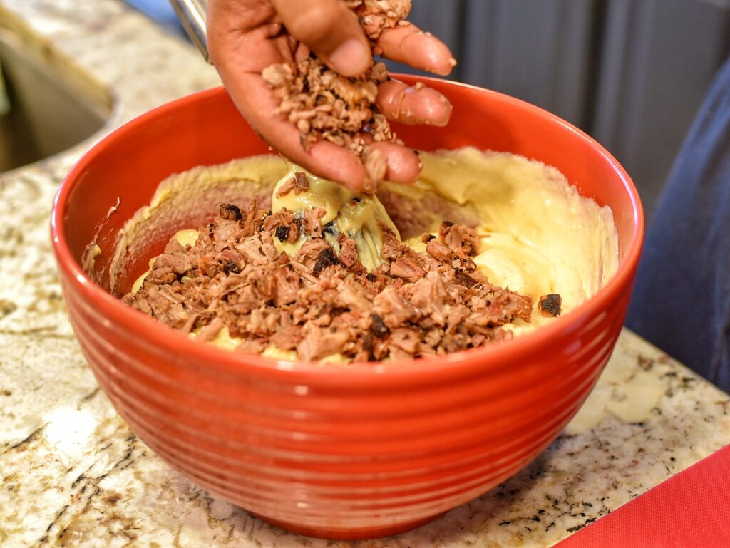 Adding chopped brisket to the mac and cheese