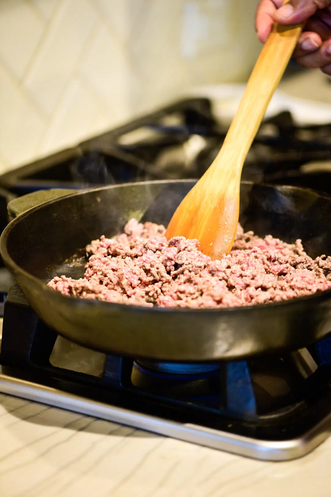 Brown ground beef in cast iron skillet