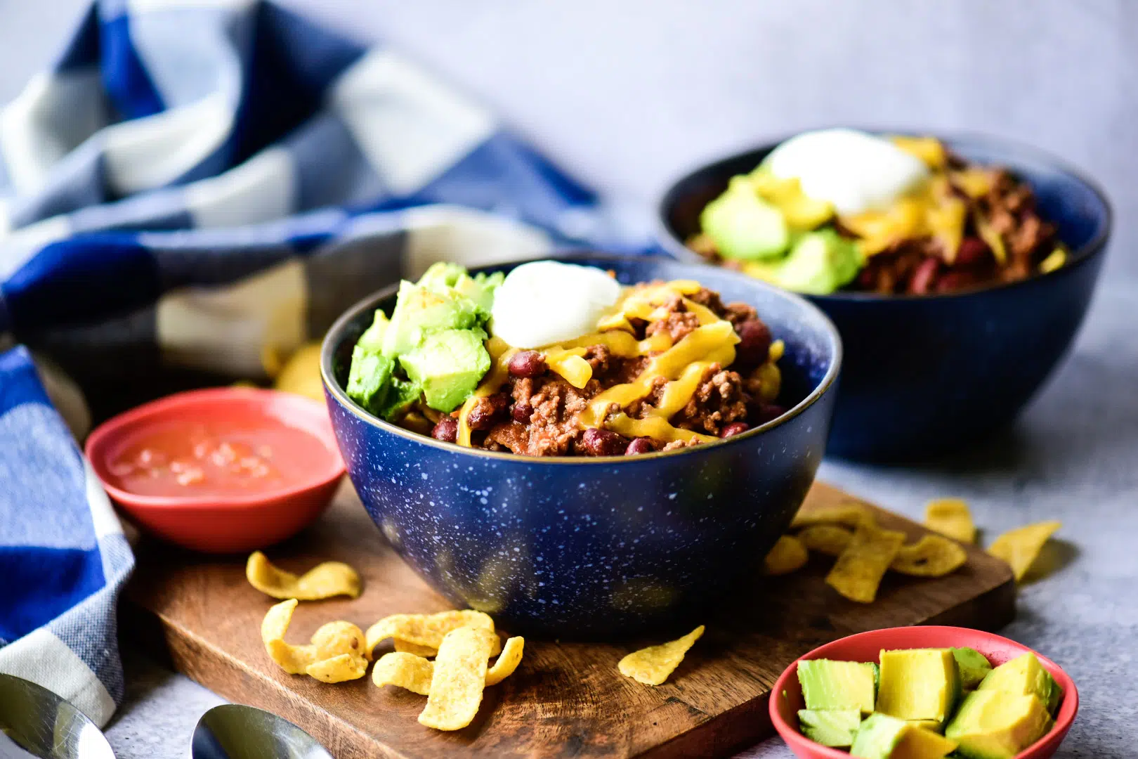 Frito pie with guacamole and sour cream