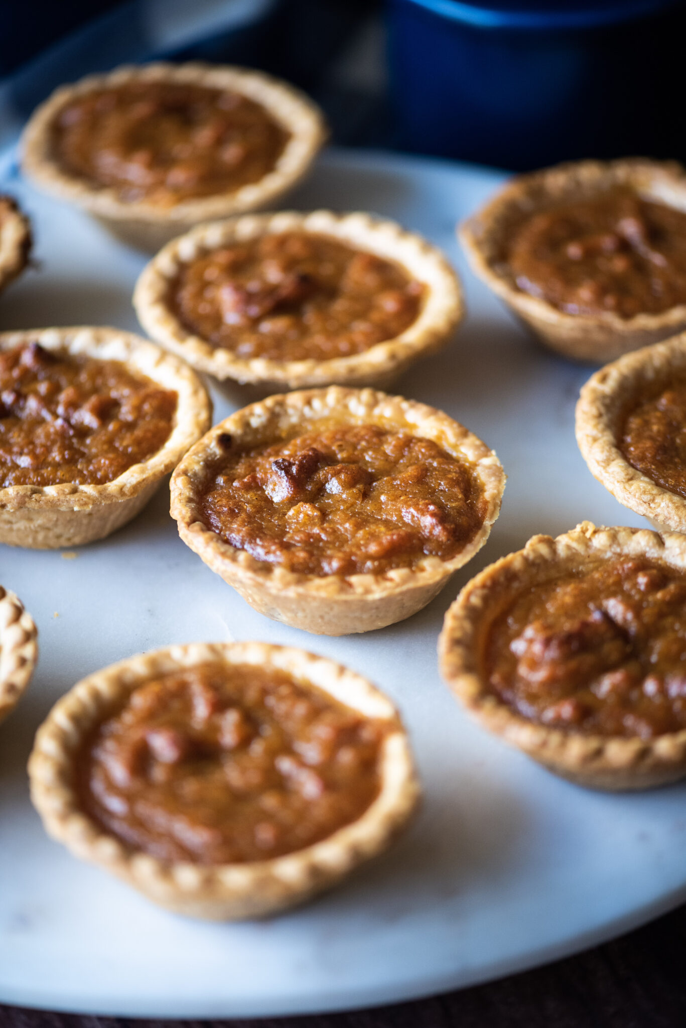 Mini sweet potato pies on a marble plate