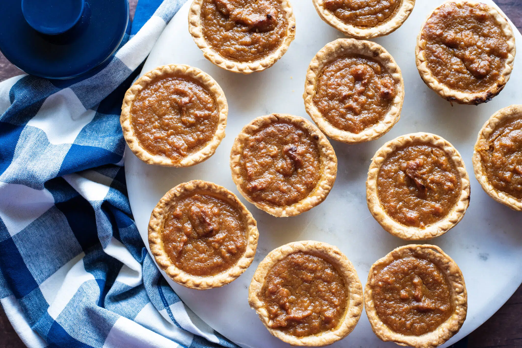 Overhead shot of a dozen mini sweet potato pies