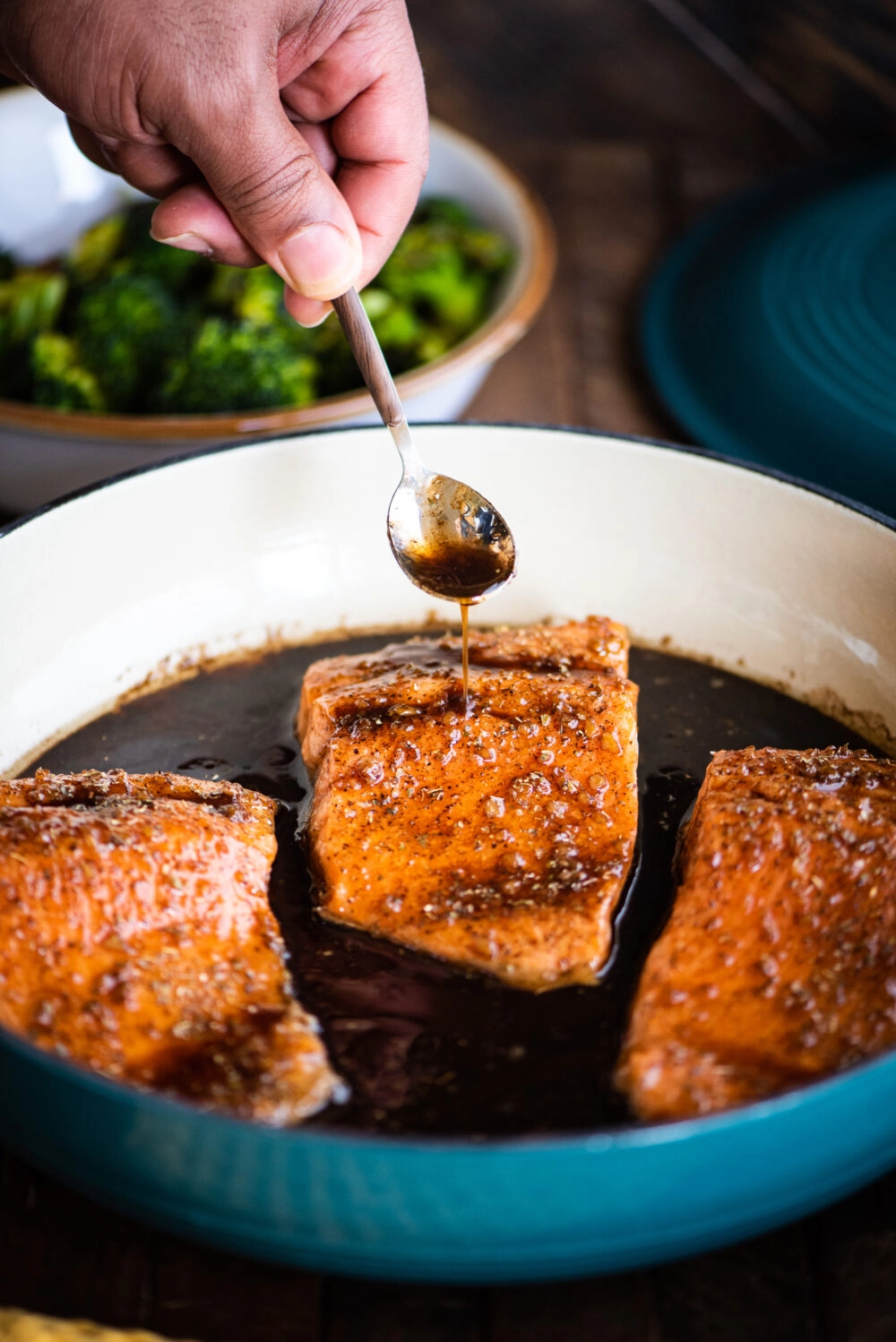 pouring extra glaze on finished fish