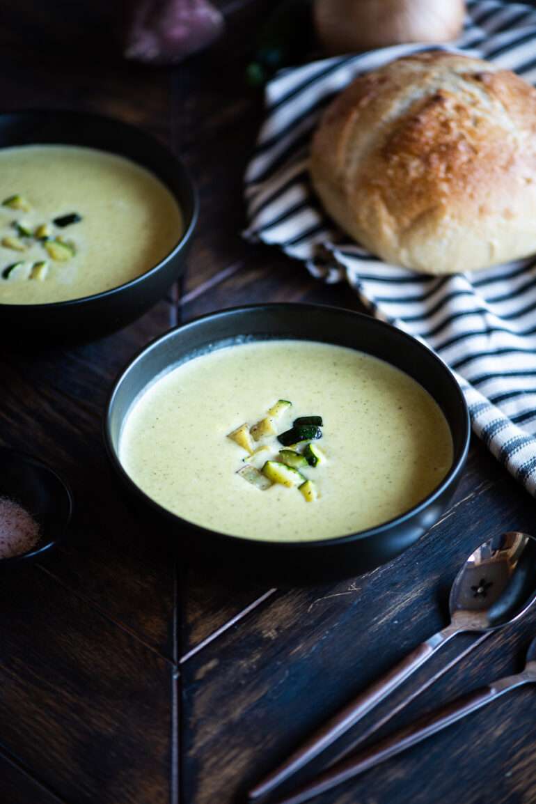 zucchini and sweet potato soup served with sourdough bread