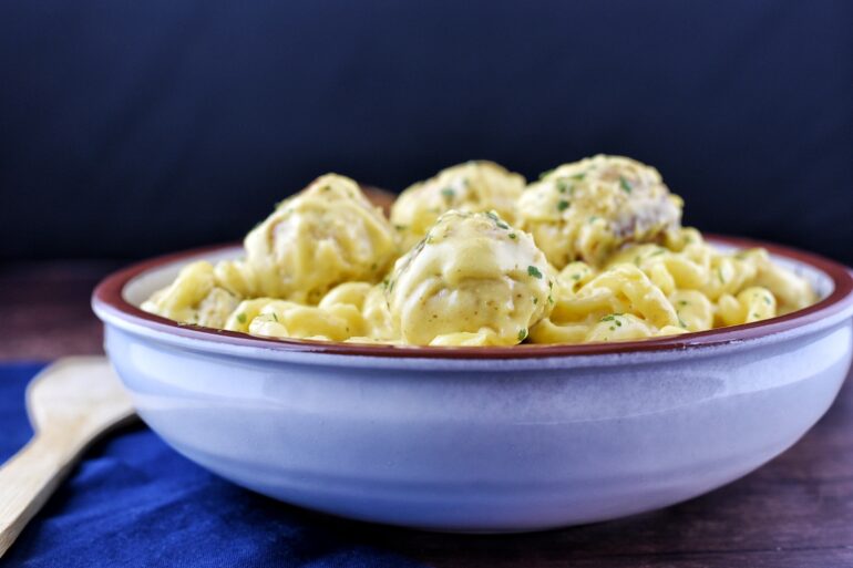 Cheesy Chicken Meatball Pasta served in a large serving bowl