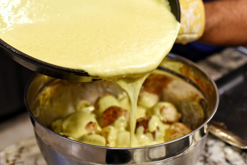 Mixing in the cheese sauce