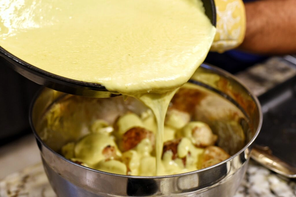 Mixing in the cheese sauce