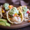 grilled fish taco front facing with avocado cream