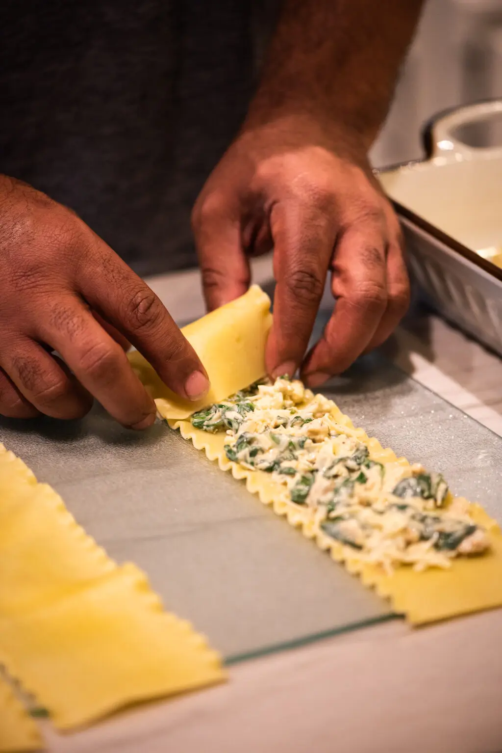 Filling lasagna rolls and rolling them up