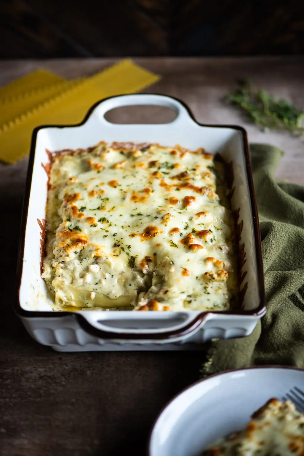 White lasagna rolls with creamy basil pesto sauce