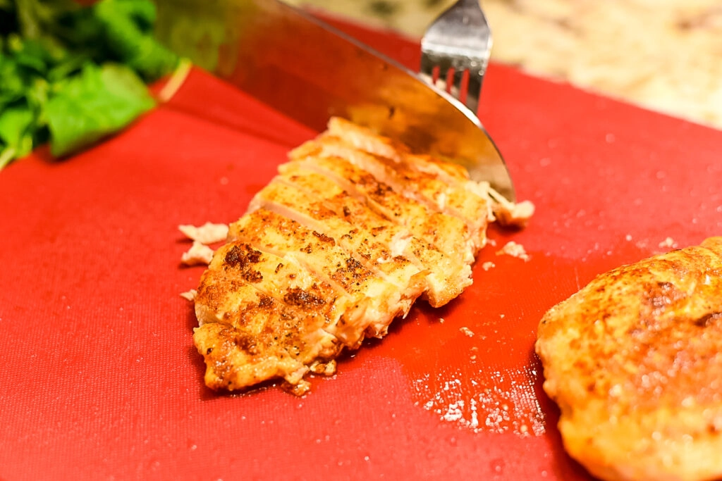 Slicing grilled chicken