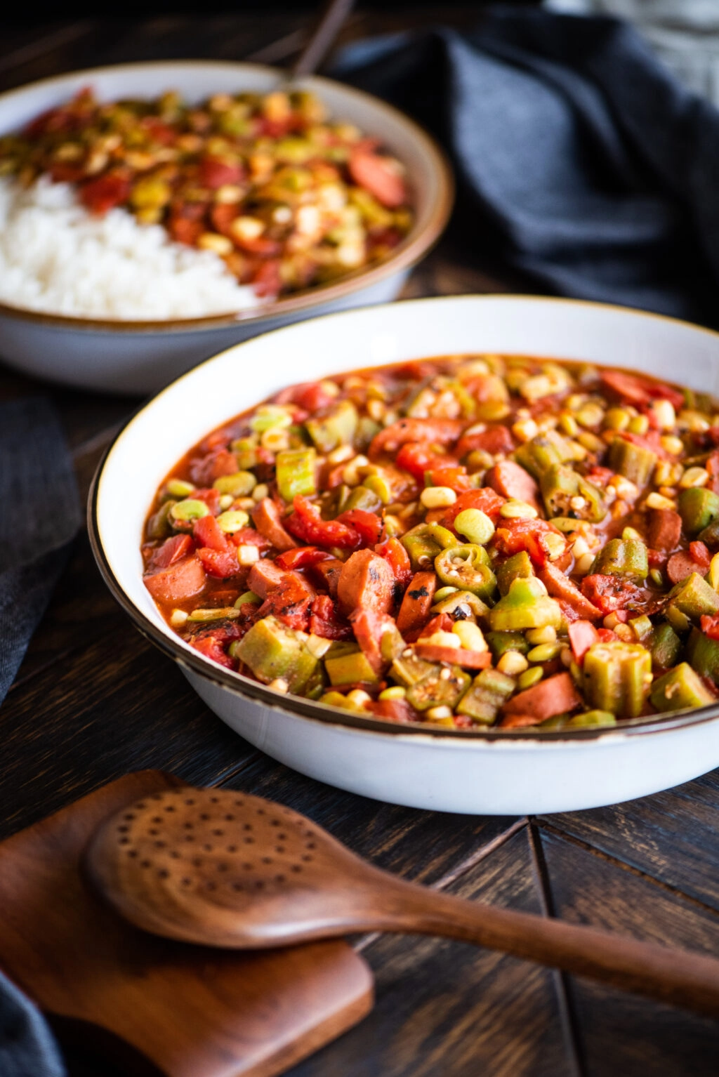 large bowl of stewed okra with a side portion of stewed okra