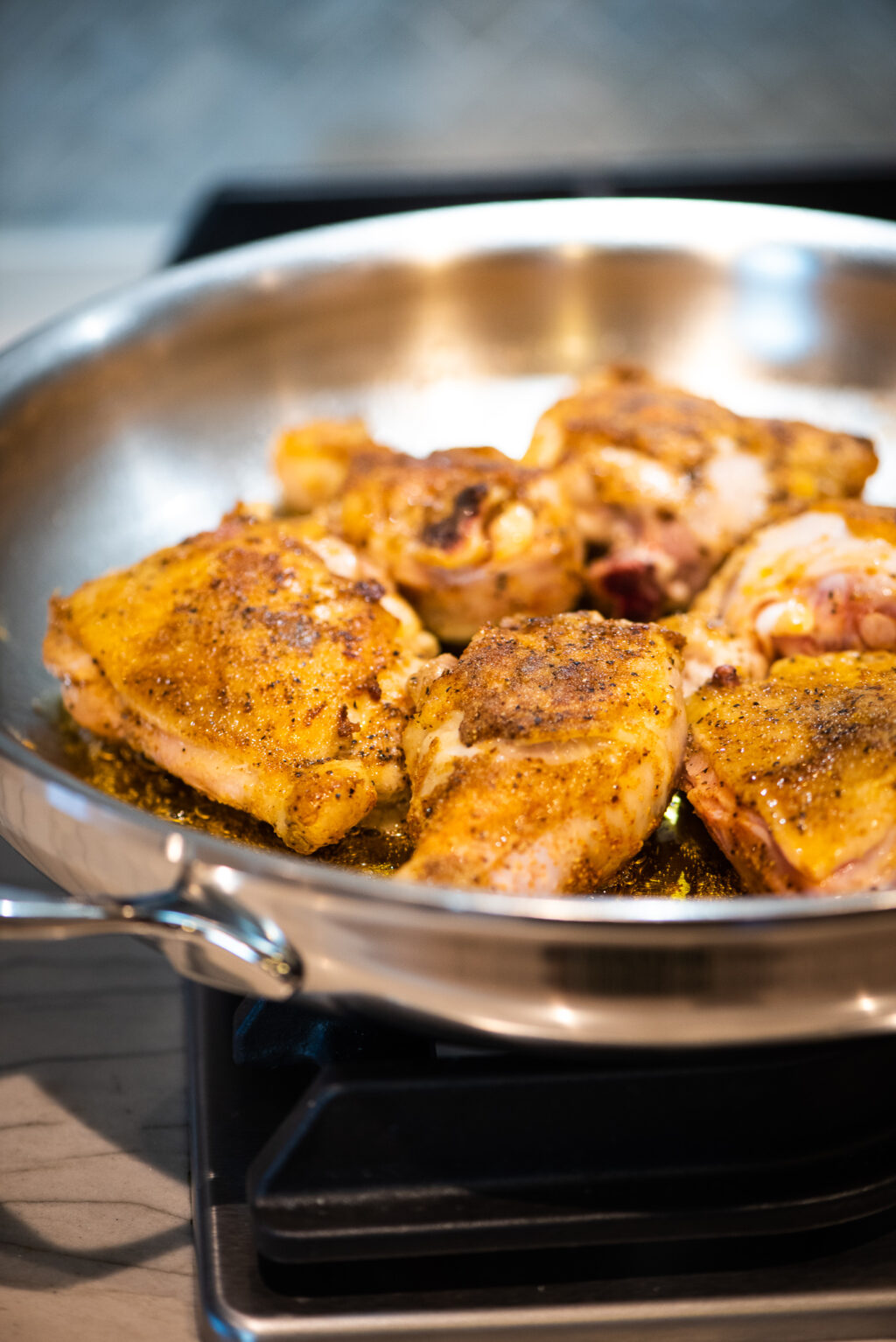 browning chicken in stainless steel skillet