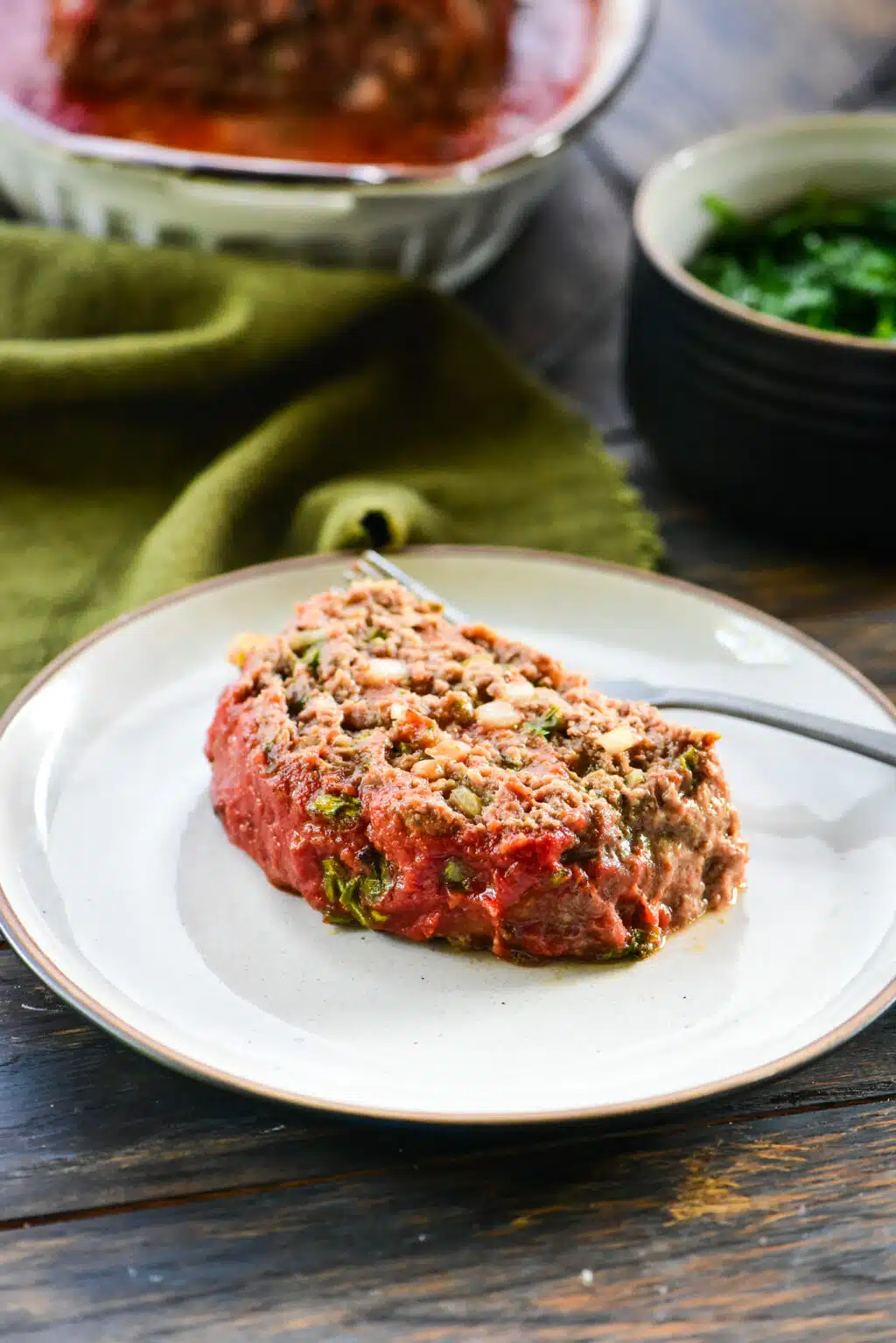 single sliced serving of meatloaf