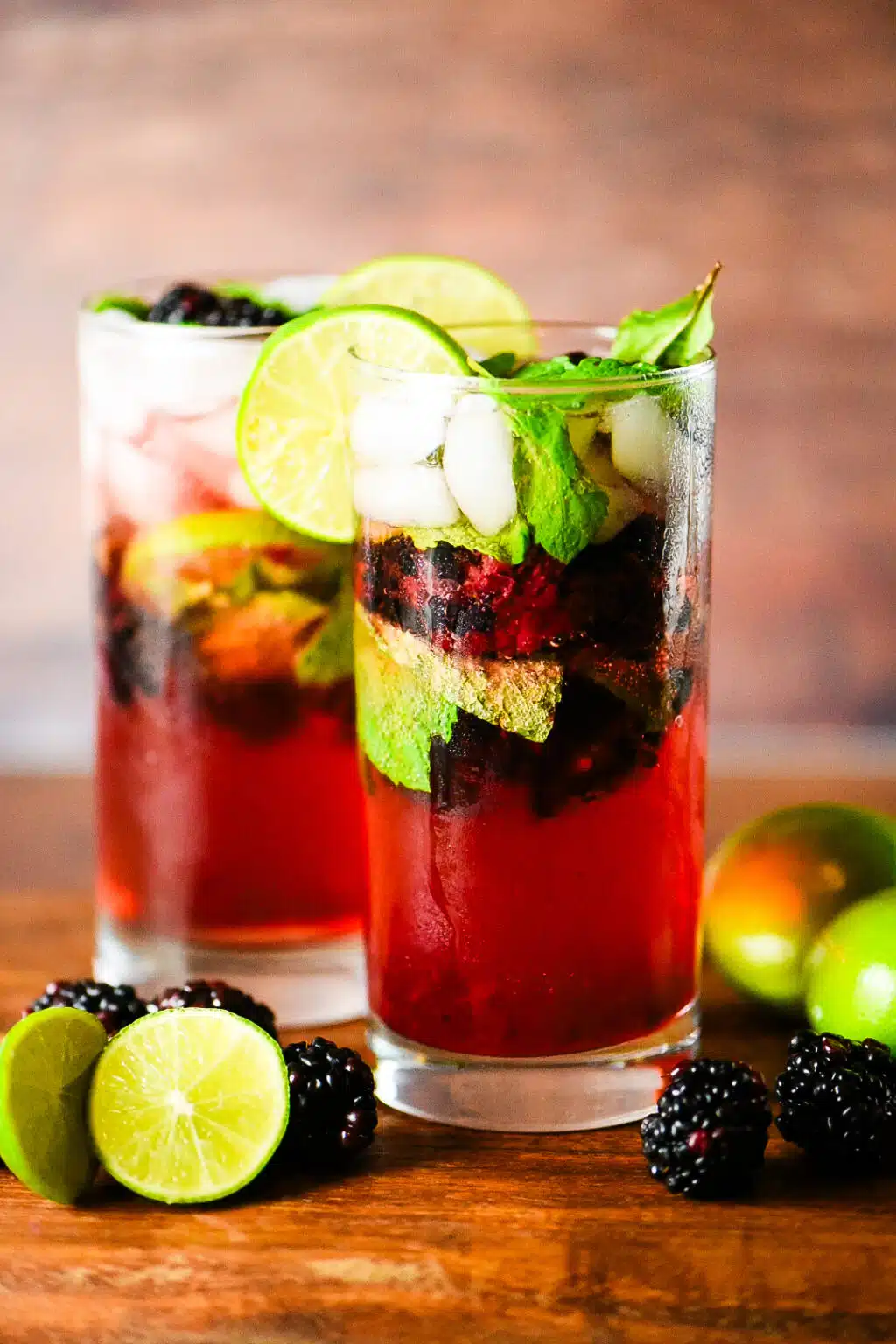 two blackberry mojitos in a tall glass
