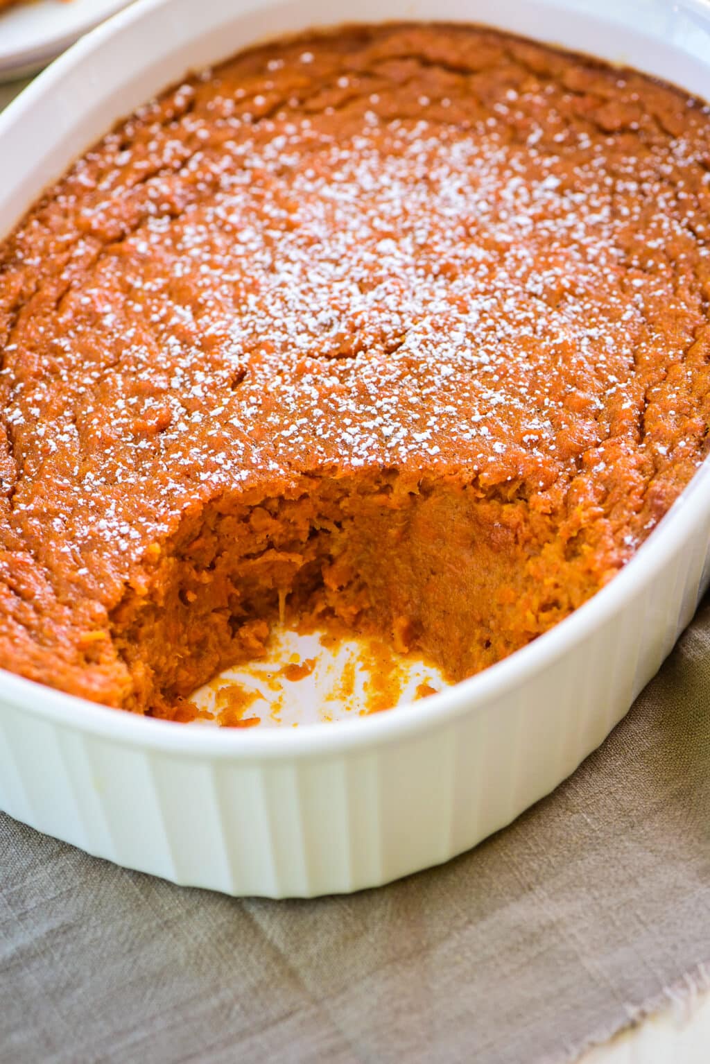 carrot souffle with a serving taken out of it