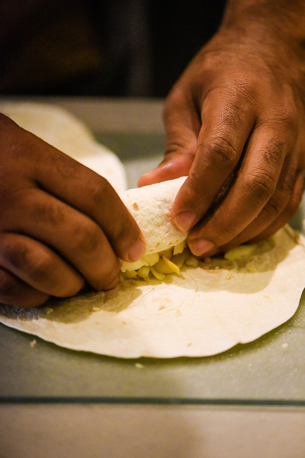 Rolling up Shredded Chicken Flautas