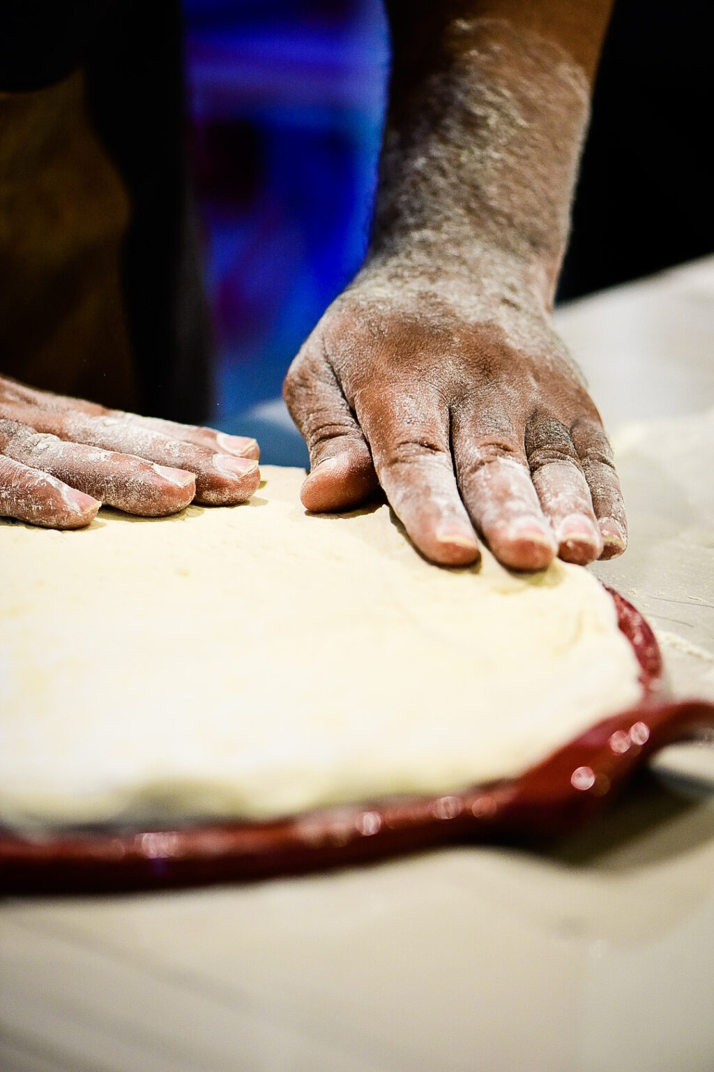 Placing dough on pizza stone