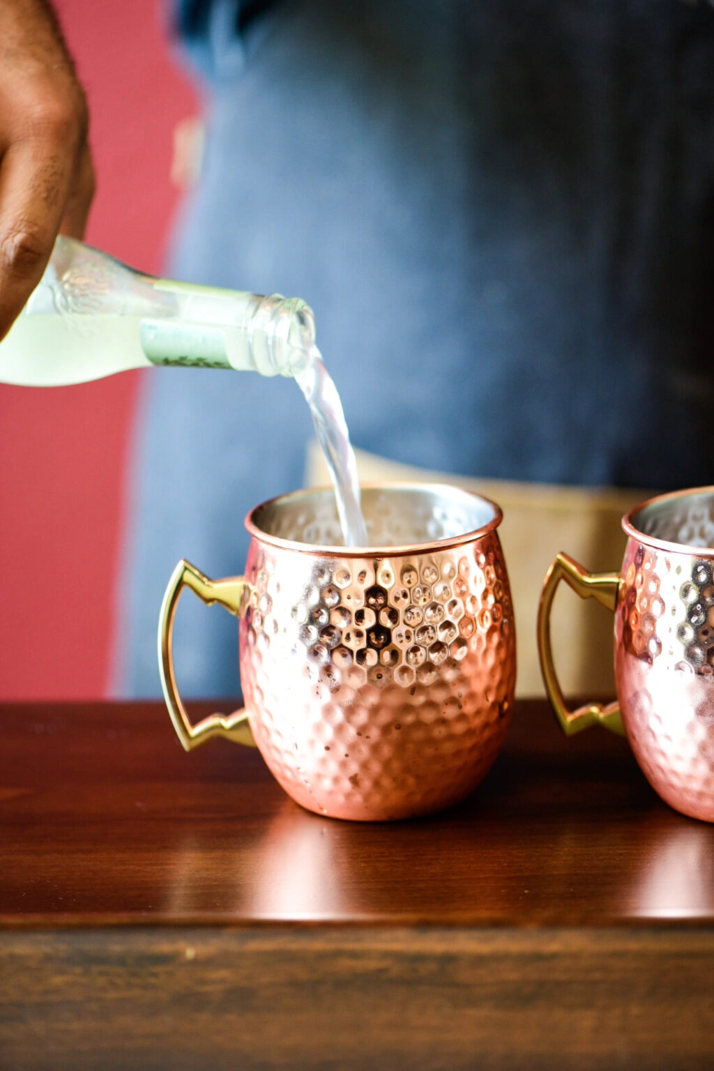 Pouring ginger beer in Watermelon Moscow Mule Cocktail