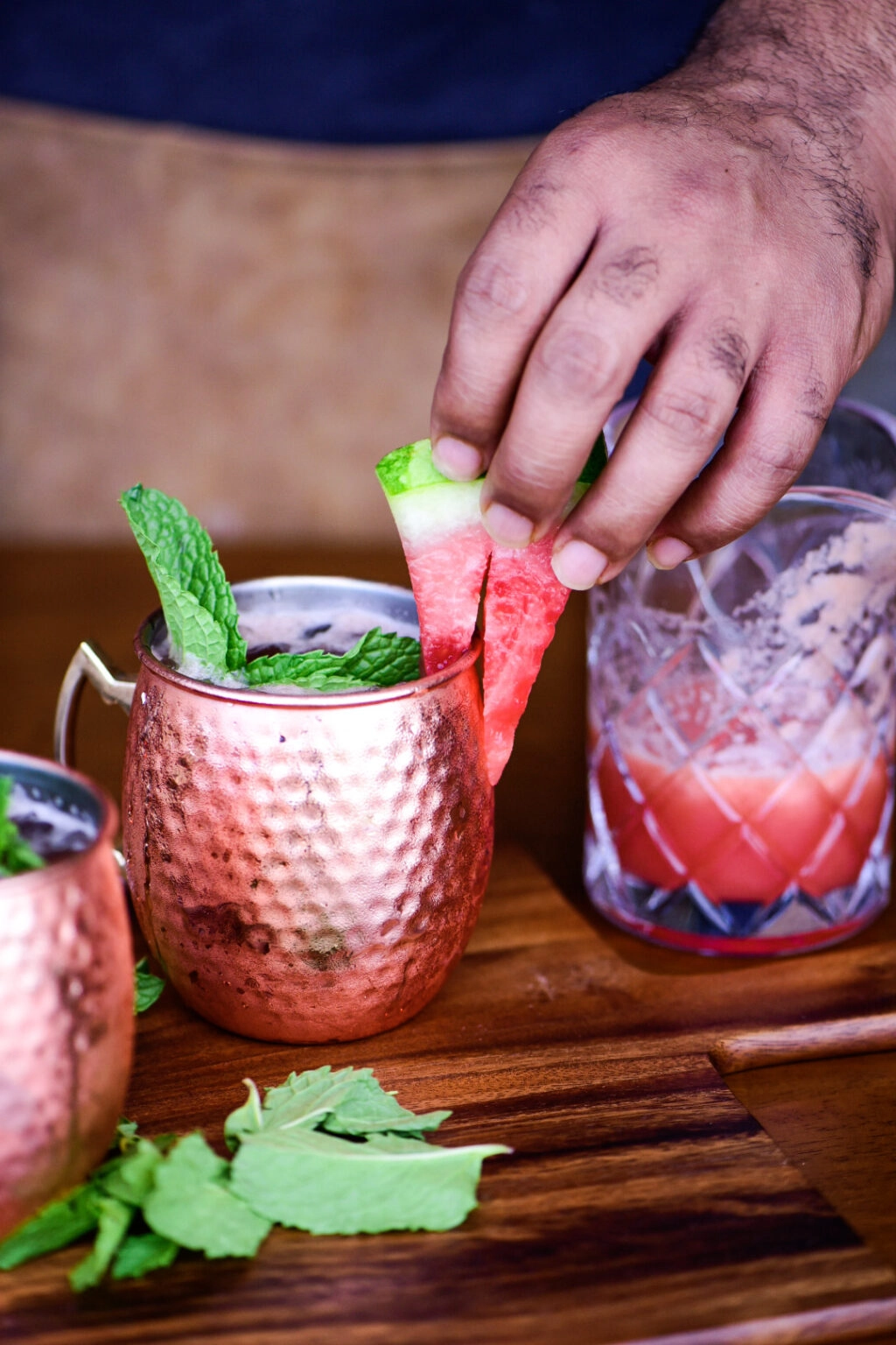 Adding watermelon to Watermelon Moscow Mule Cocktail