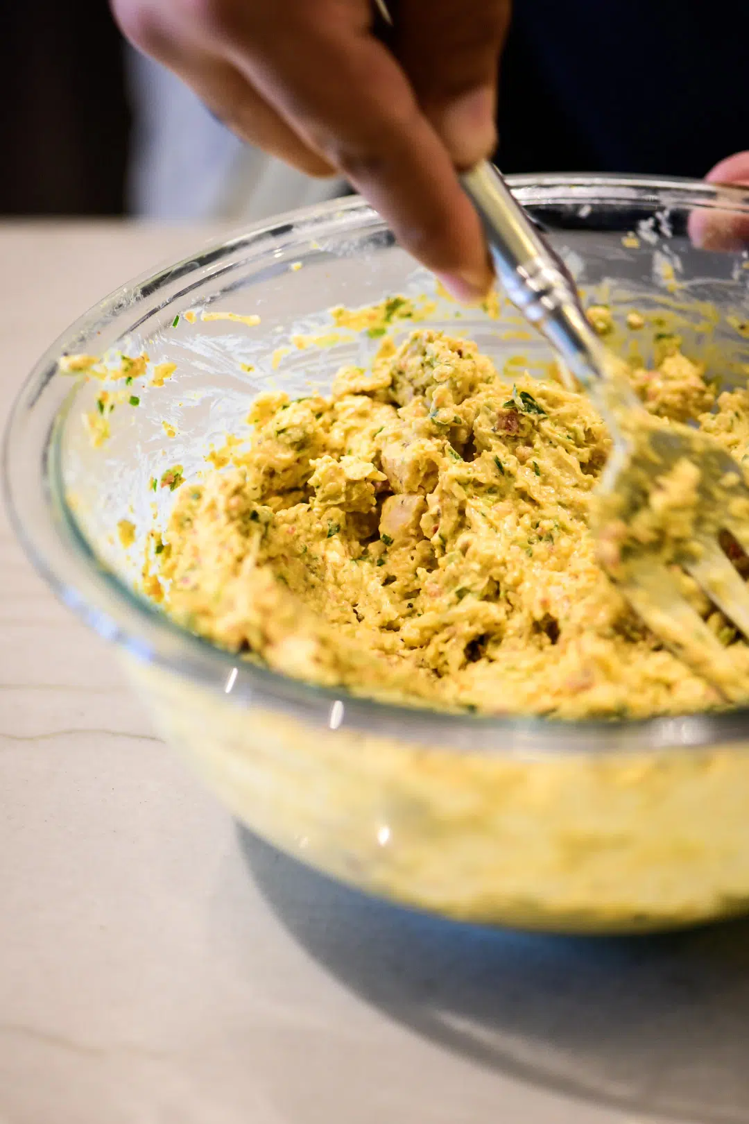 Blending dip ingredients in a large bowl