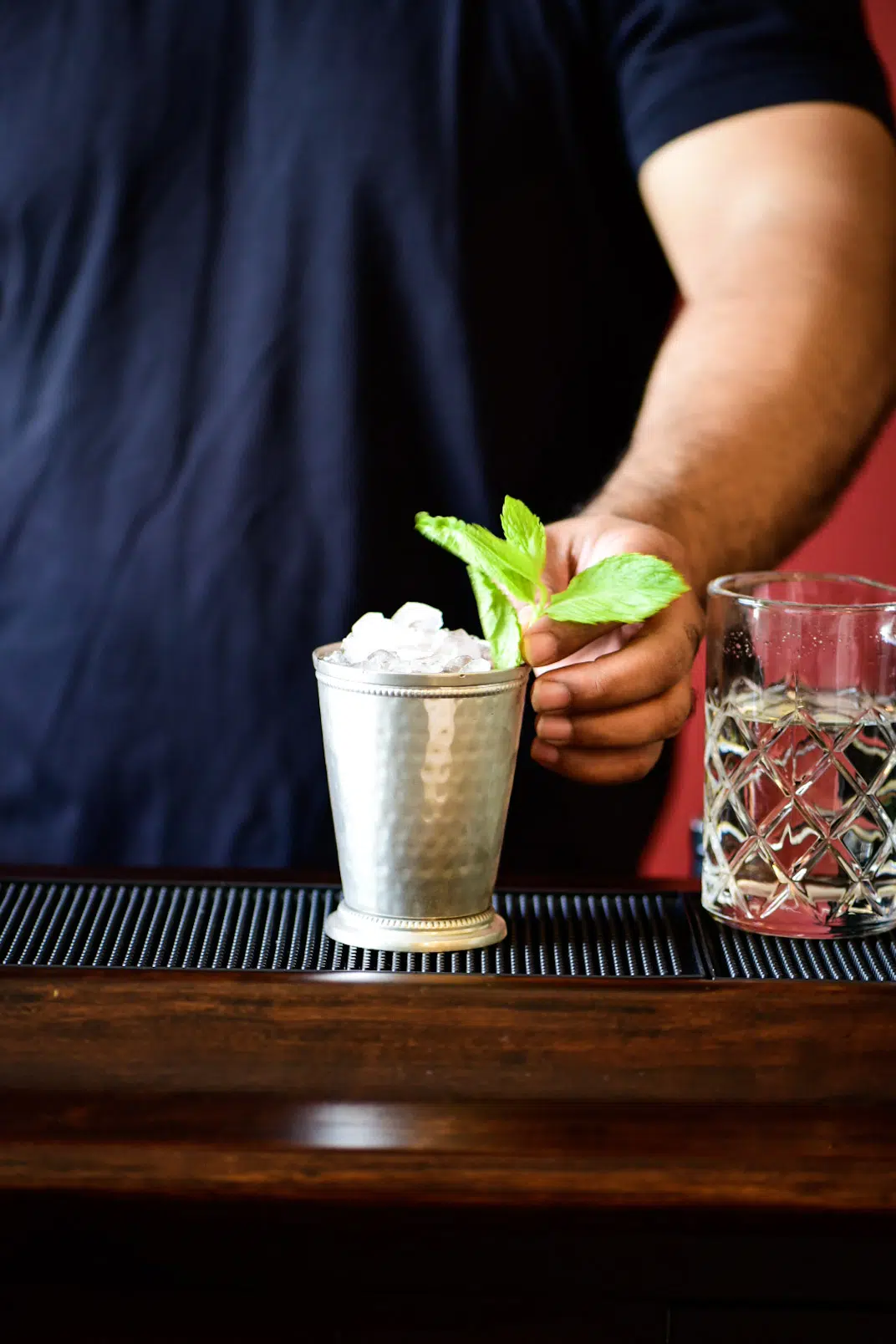 Adding fresh mint leaves as a garnish