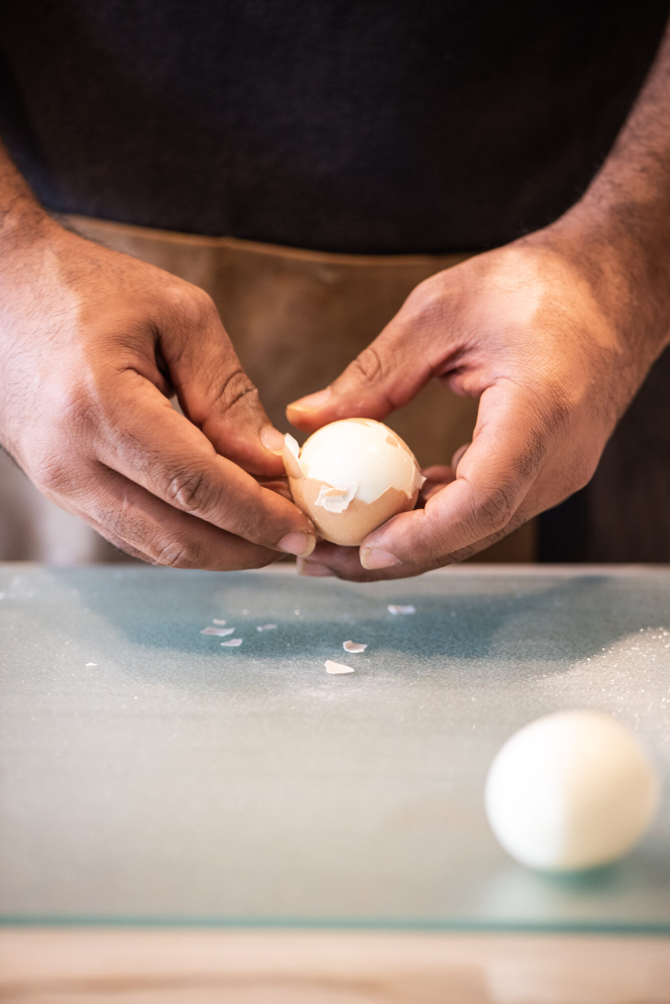 Removing shell from hard boiled eggs