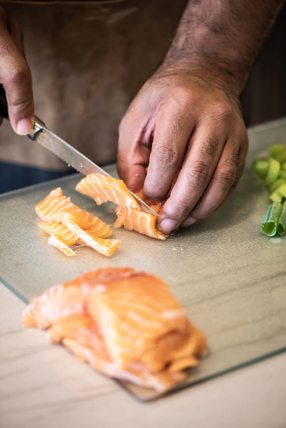 Cutting fresh salmon for salmon croquettes