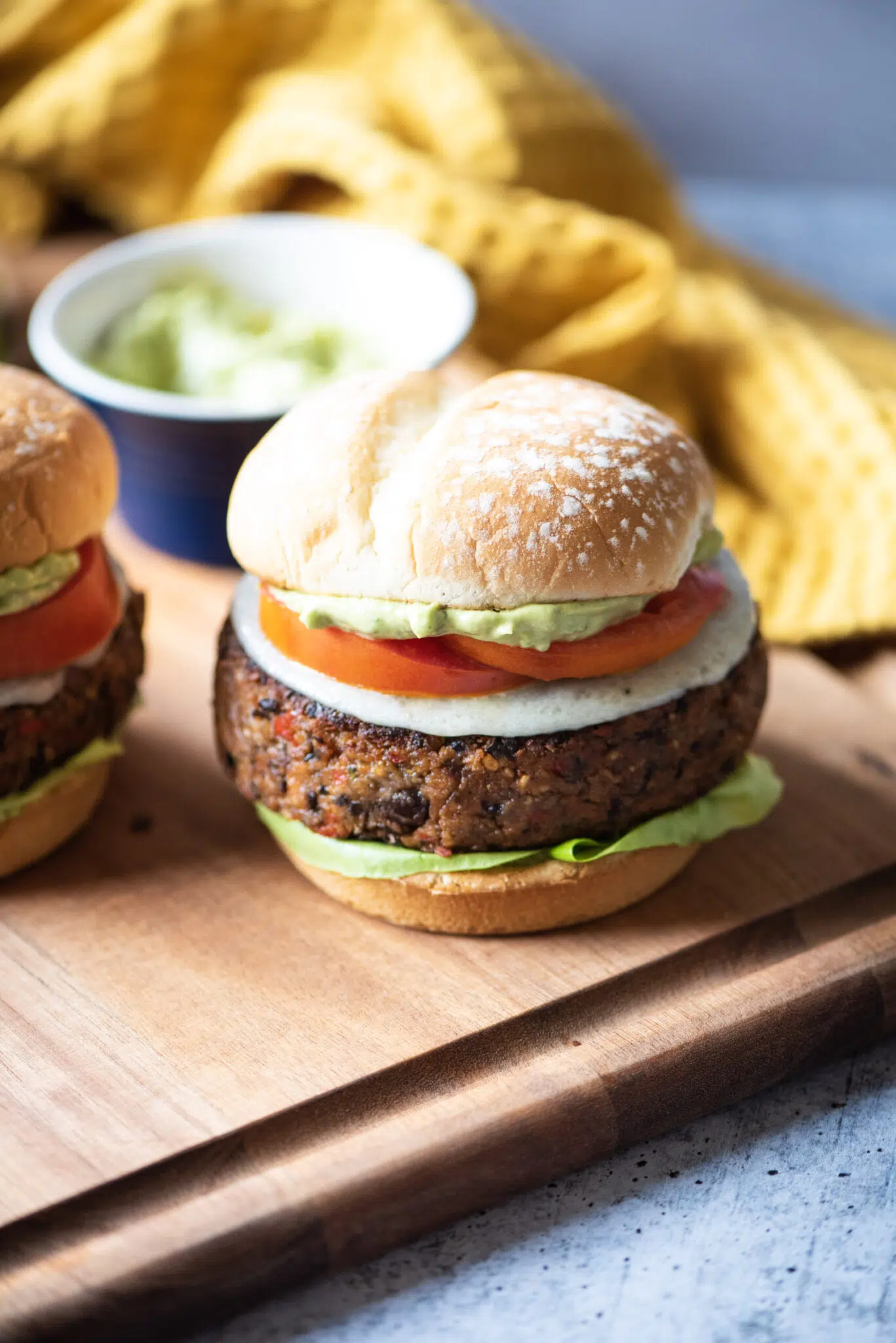 Black bean burger with side of avocado cream sauce