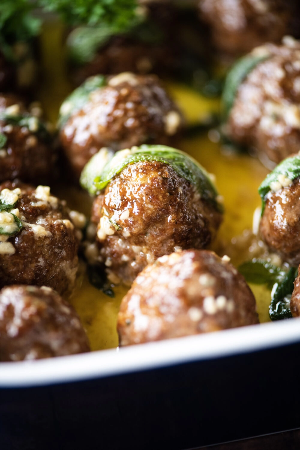 Single meatballs with sage leave on top