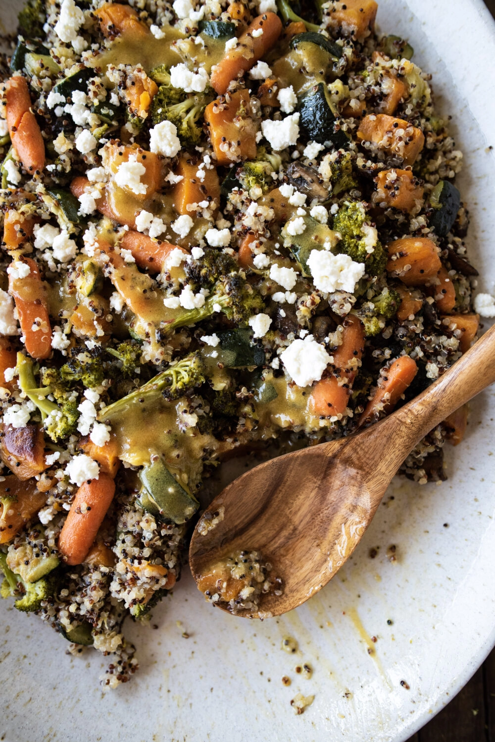 quinoa with roasted vegetables topped with feta crumbles