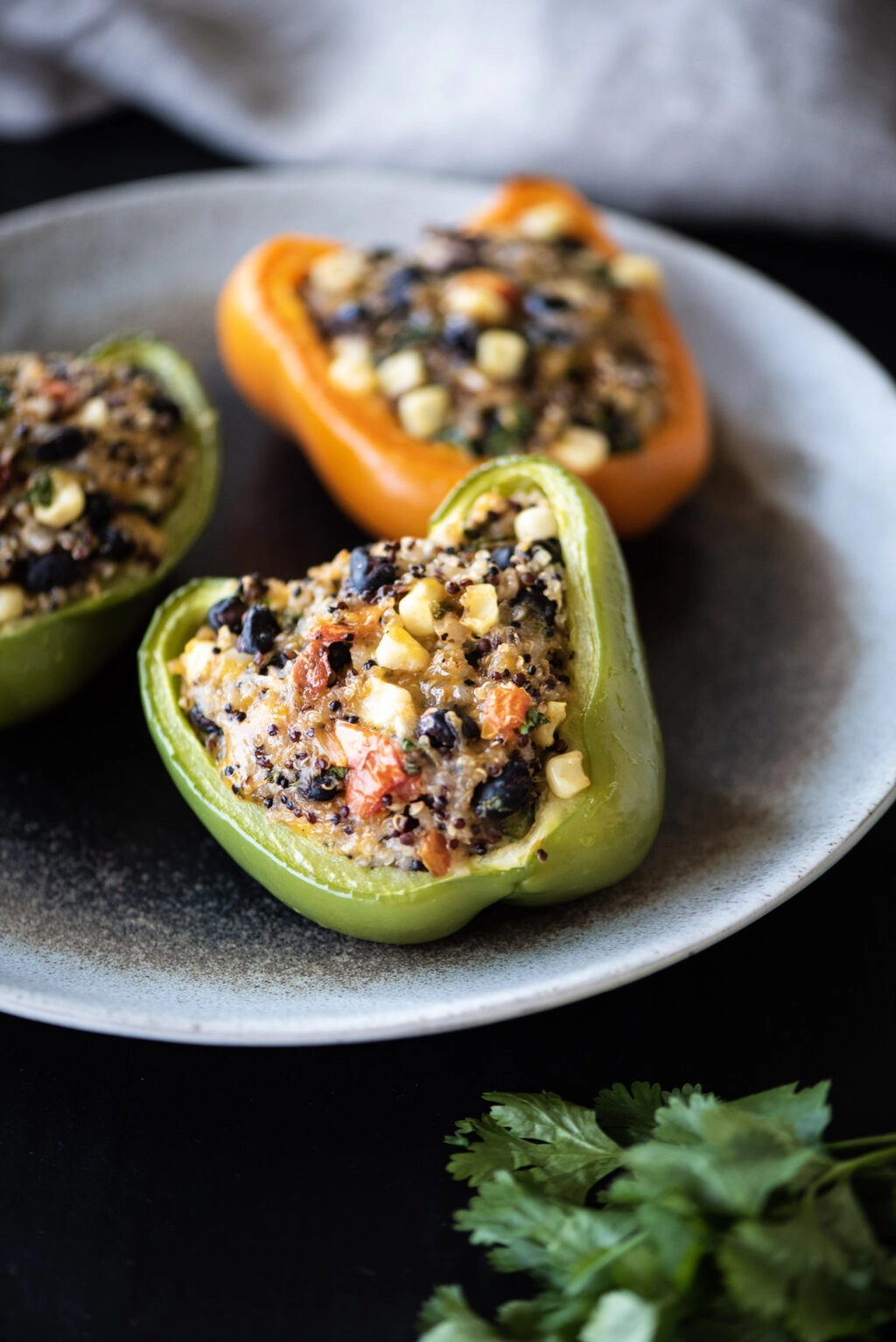 three quinoa stuffed bell peppers