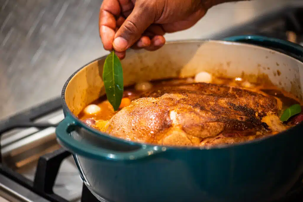 adding bay leaves to broth