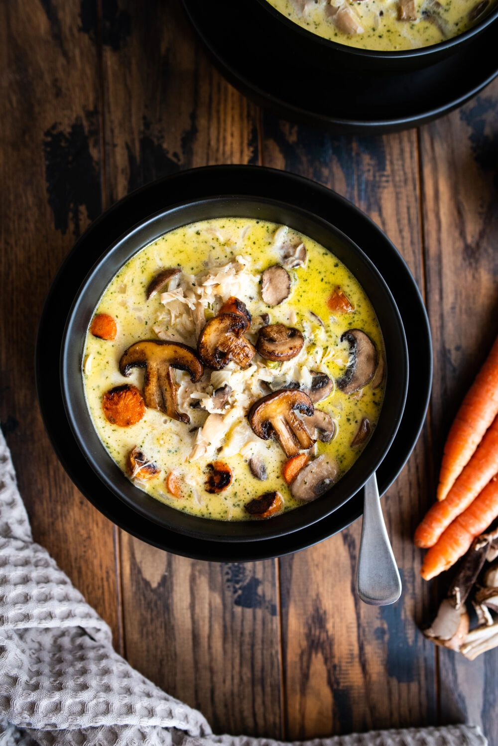 overhead shot of creamy chicken and rice soup with roasted veggies