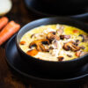 Two bowls of creamy chicken and rice soup