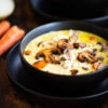 Two bowls of creamy chicken and rice soup