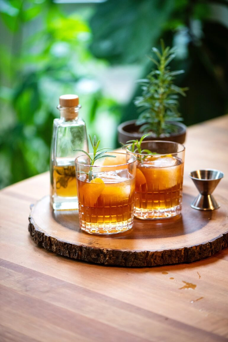 cocktail made with whiskey and infused honey and rosemary simple syrup
