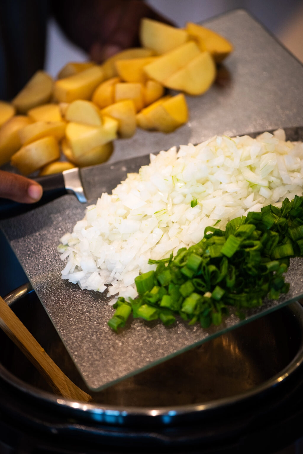 adding onion, scallions, and potatoes to instant pot