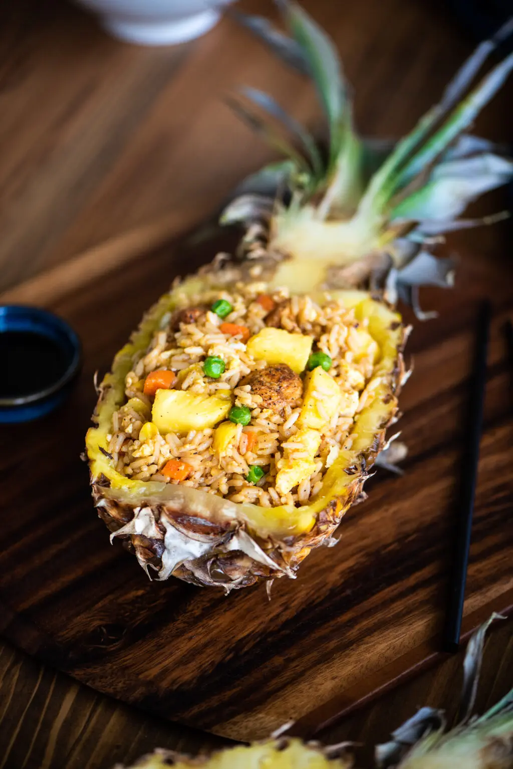pineapple fried rice served in a pineapple boat