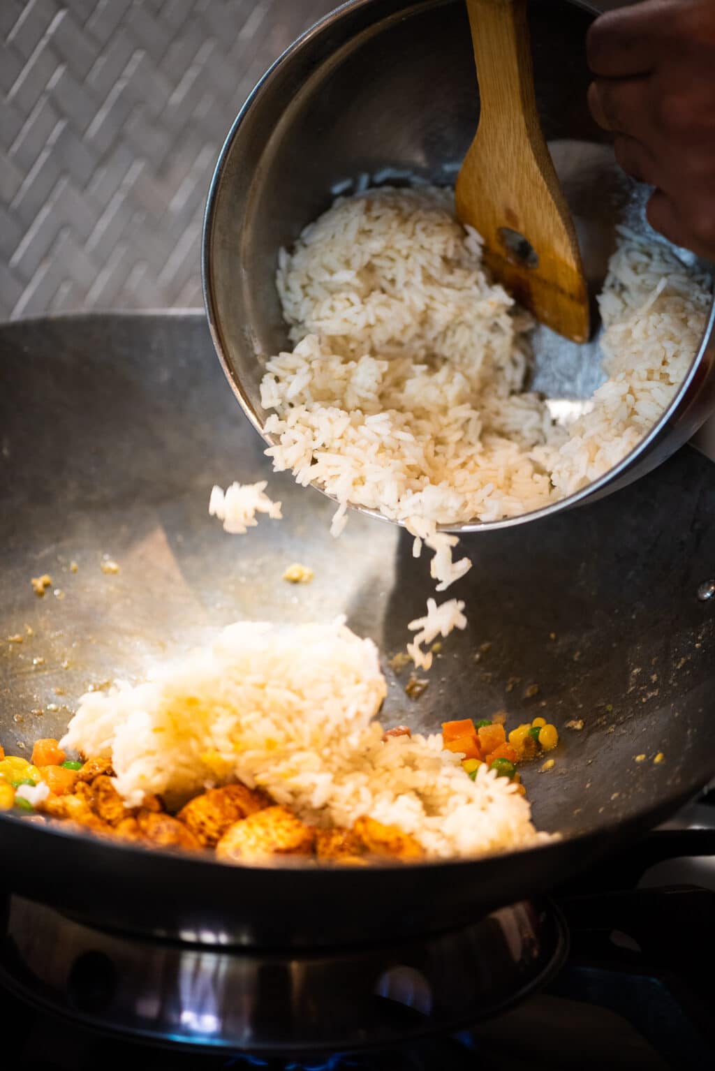 Add cold day old rice to wok
