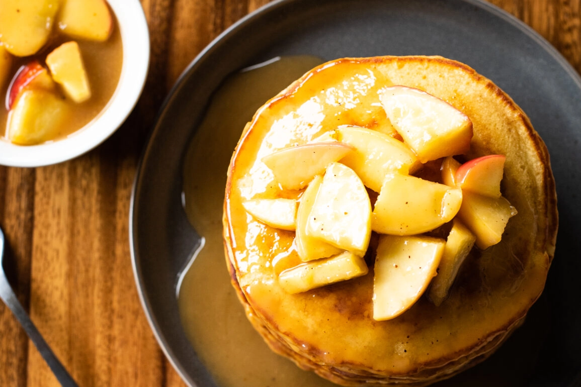 Overhead shot of spiced buttermilk pancakes with caramelized apples
