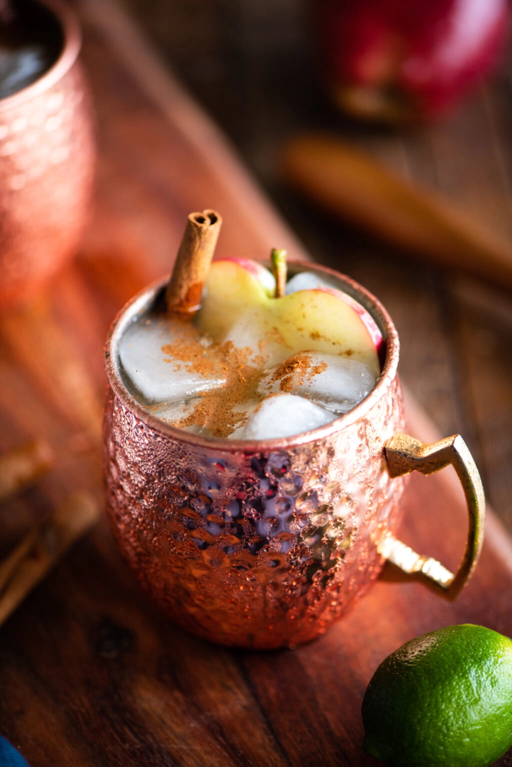 apple cinnamon moscow mule in a copper mug