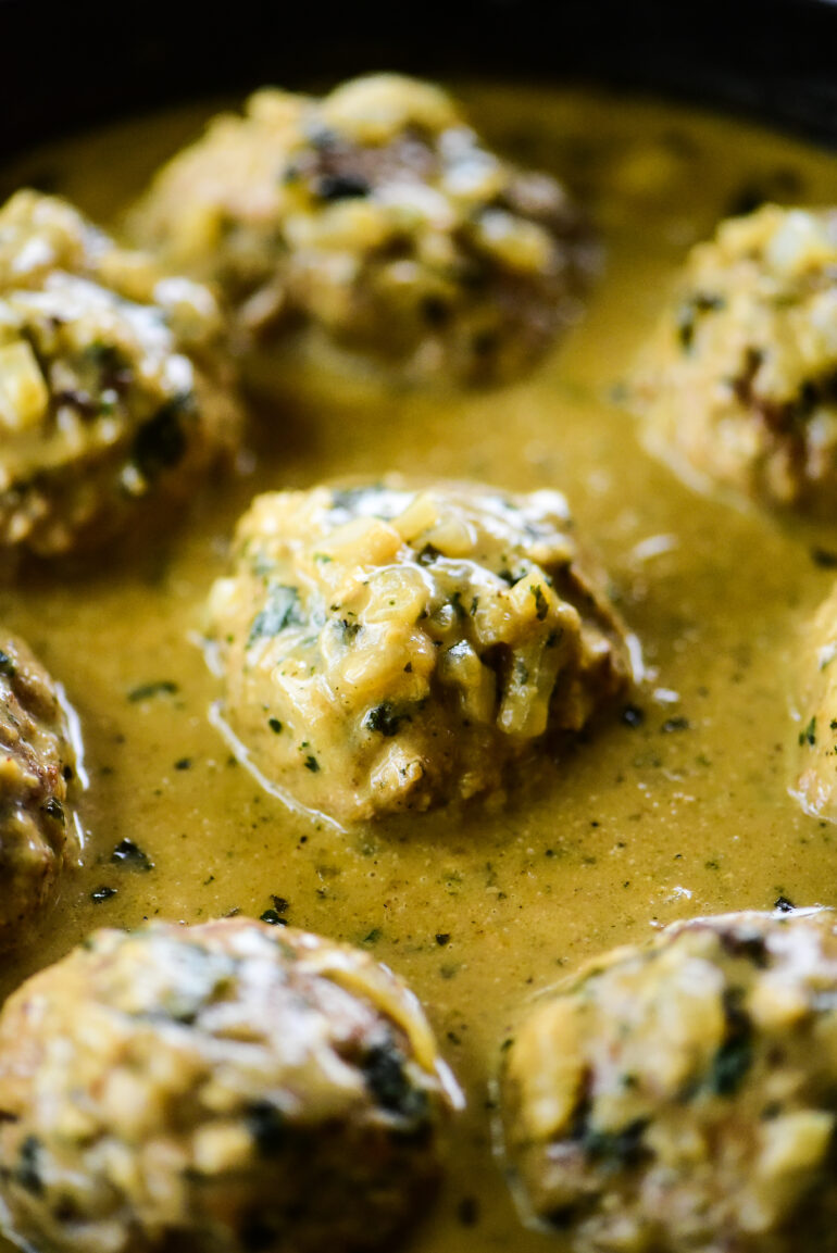 close up of turkey Swedish meatballs in cast iron skillet