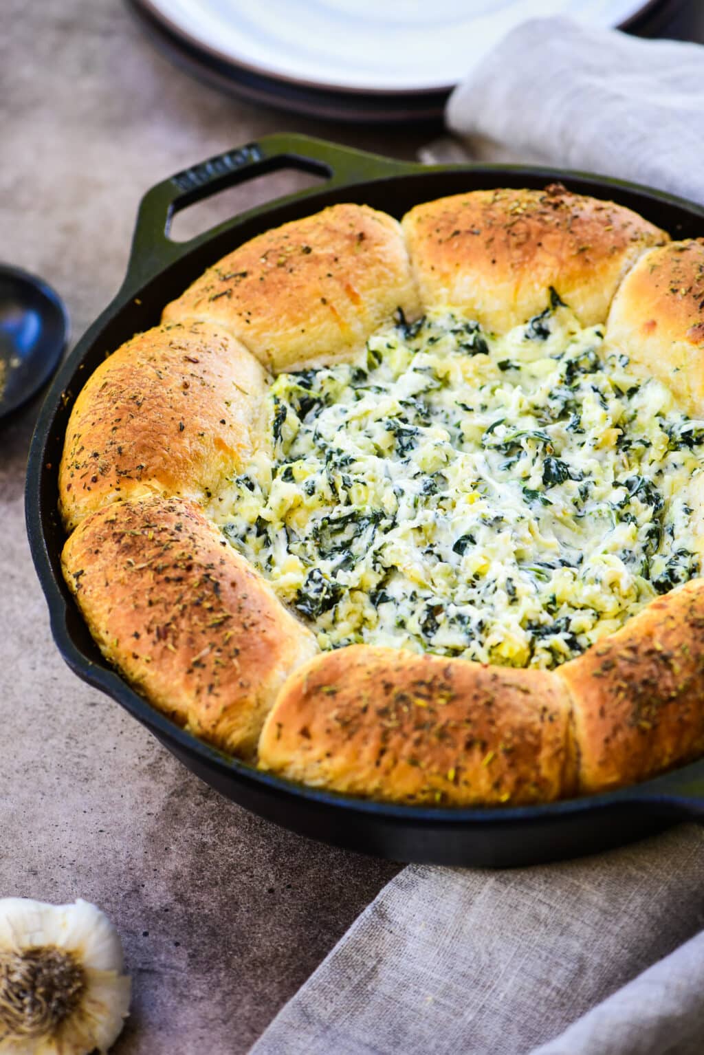 artichoke dip served with pull apart herb butter biscuits
