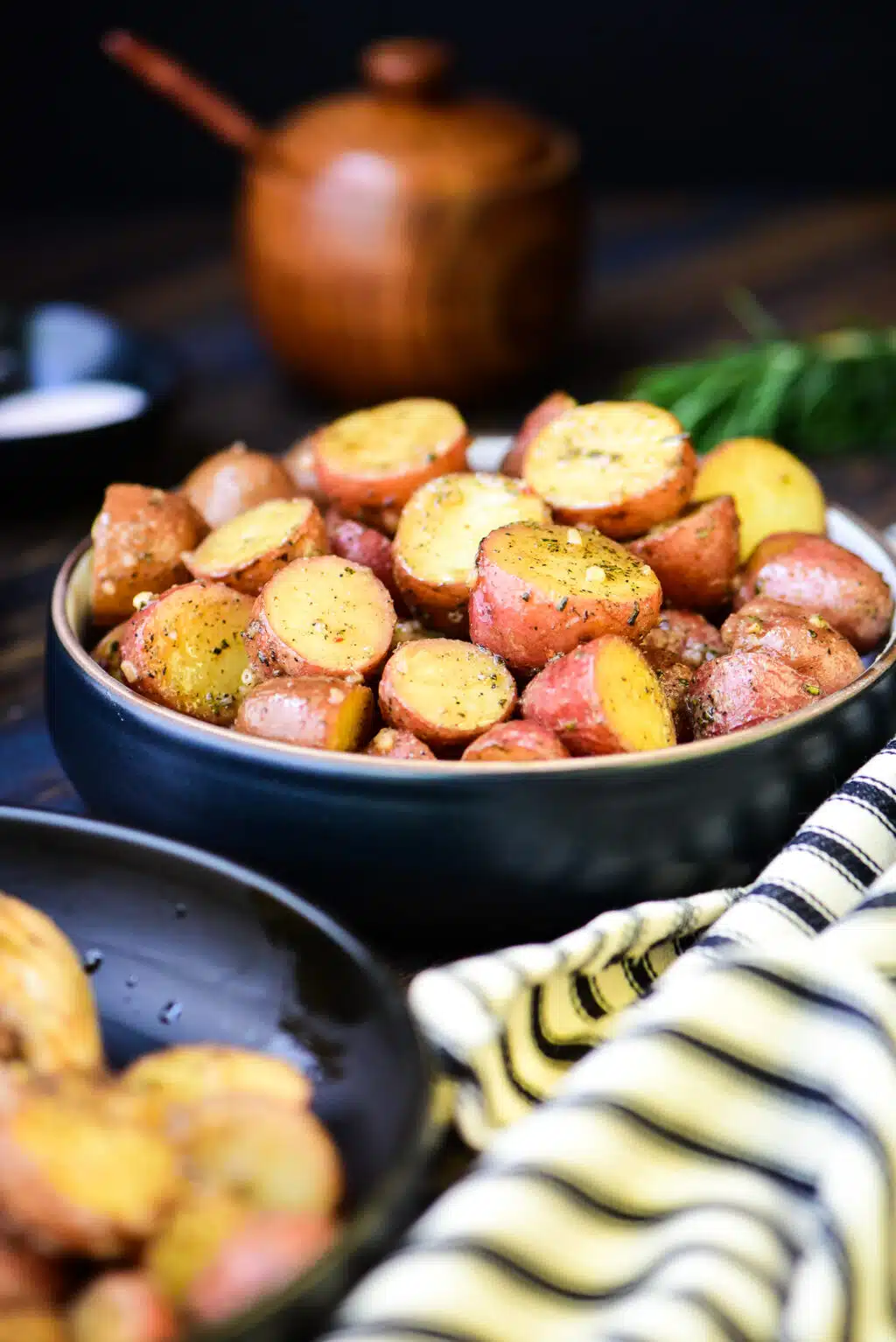 small bowl of roasted potatoes with vinaigrette