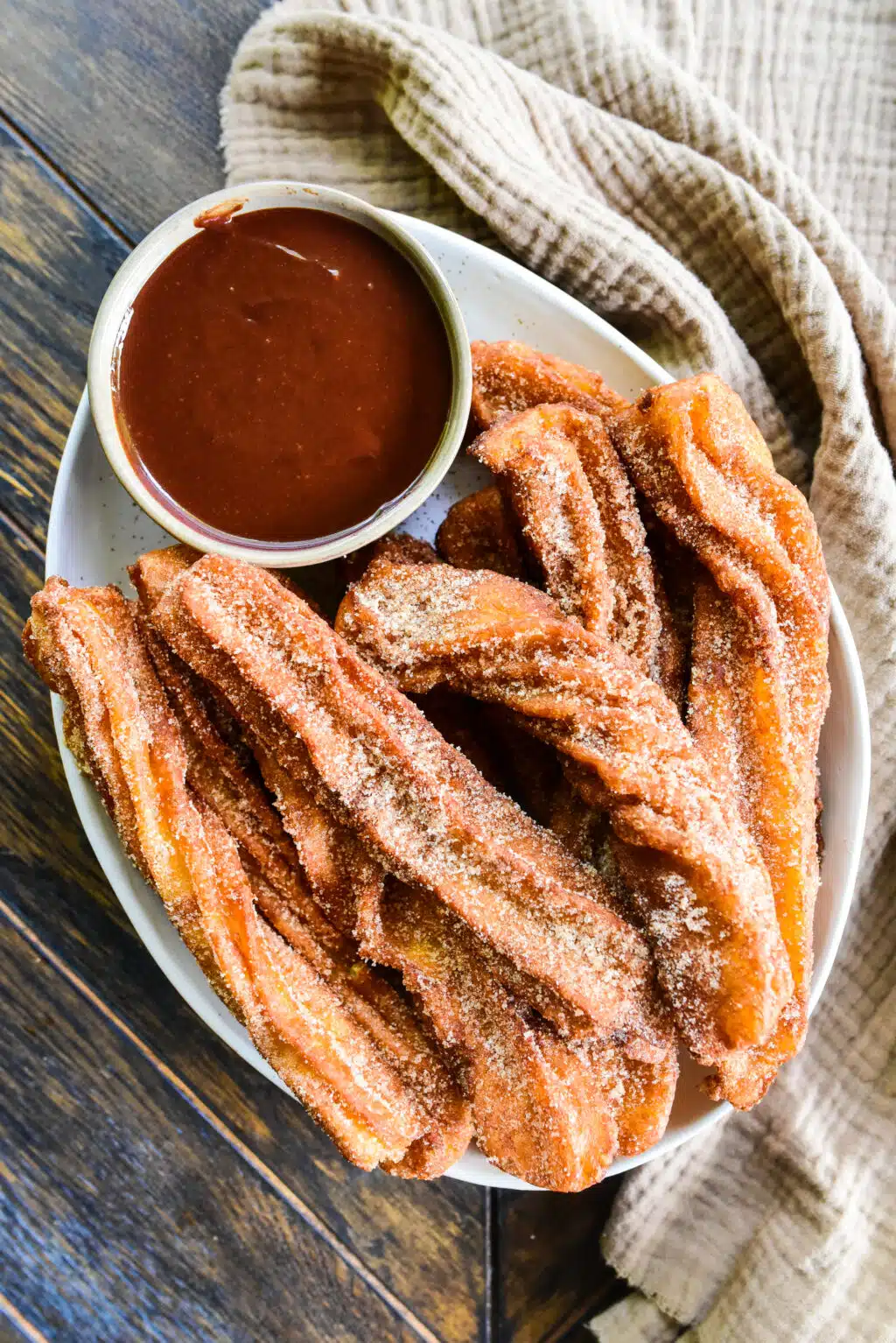 plate of churros with chocolate dipping sauce