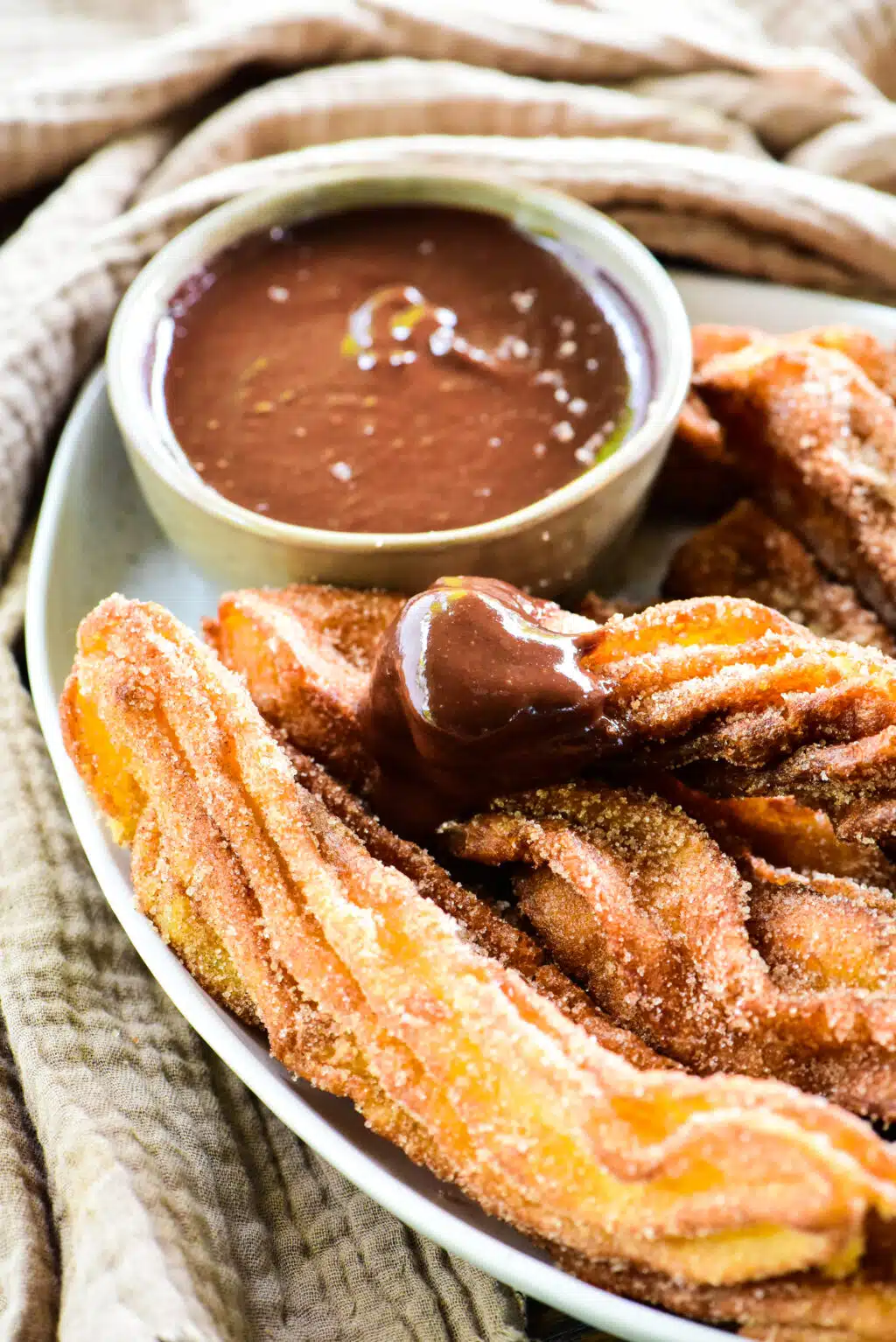 churro dipped in chocolate sauce