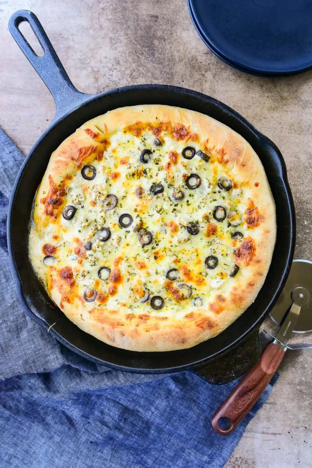 overhead shot of cast iron chicken pizza