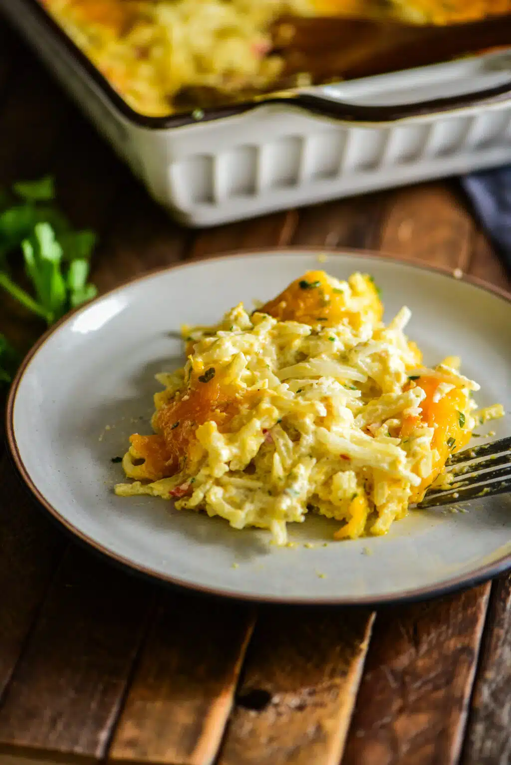 Individual serving of hashbrown casserole on a small plate