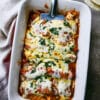 overhead shot of cheese enchiladas in a large casserole dish