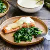 seared salmon and creamy mustard sauce served with sauteed spinach